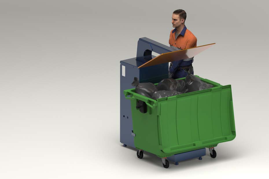 operatorius, suspaudęs atliekų į 1100 LTR konteinerį.